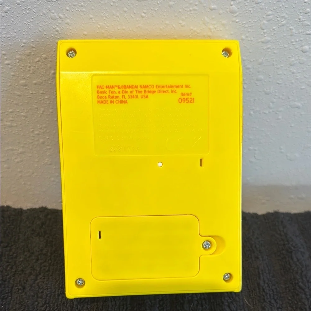 PAC-MAN & BANDAI NAMCO Yellow Handheld Console with Classic Game Design